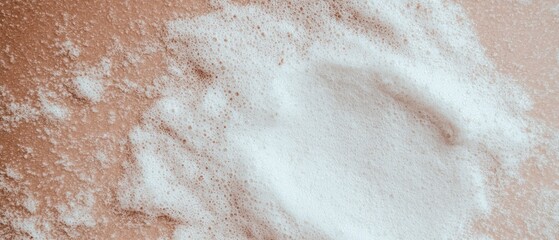 Fototapeta premium A close-up of white powder scattered on a surface, suggesting a culinary or scientific use.