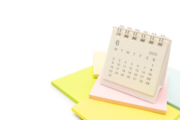 Desk Calendar for JUNE 2025 background. Calendar concept with 2025 JUN calendar on Sticky note. isolated on white background.