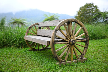 Wooden garden chair, placed in the middle of the park