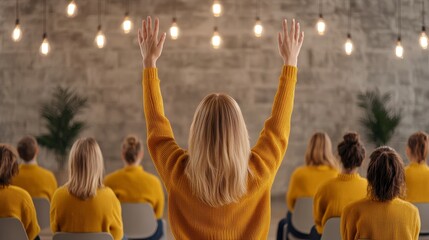 Row of students in modern classroom setting, backs visible, with one student raising a hand in engagement, interactive learning concept