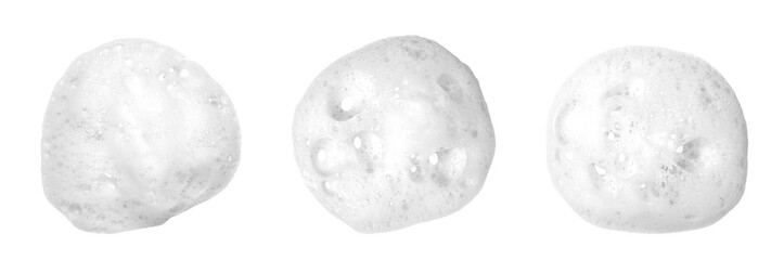 Liquid white foam from soap, shampoo or bath foam. Abstract soap bubbles. Set of soap bubbles. Separated soap bubbles on white background with contrasting texture.
