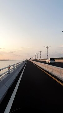 the atmosphere of the Bali Mandara toll road in the afternoon with the sunset