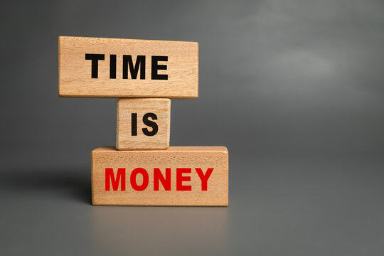 time is money words text on wooden blocks on grey background