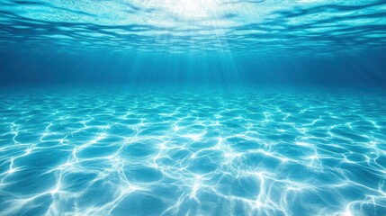Obraz premium Serene underwater scene with sun rays illuminating the ocean