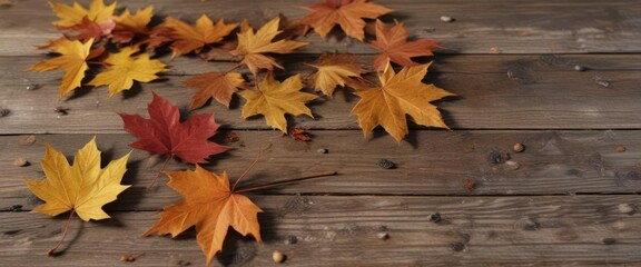Obraz premium Warm tones of isolated maple leaves scattered on a rustic wooden surface, maple leaves, foliage, nature