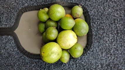 a bunch of guava on the carpet