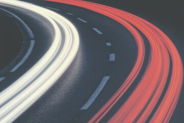 A road with a white line and a red line