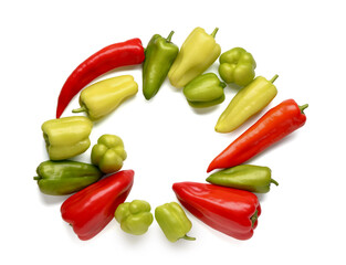 Frame made of different fresh peppers on white background