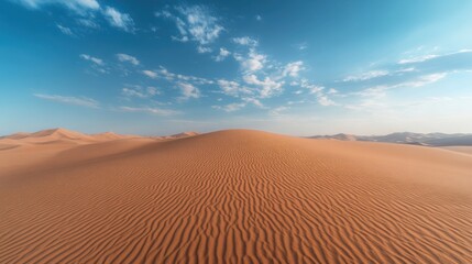 Rippled Sand Dunes Under a Clear Blue Sky