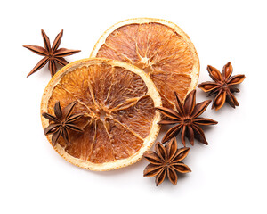 Star anise with dried oranges on white background, top view