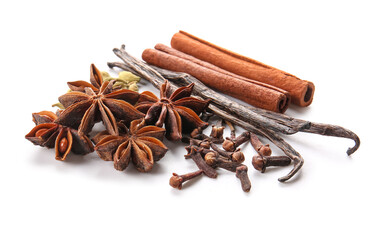 Star anise with cinnamon sticks, cloves and vanilla pods on white background