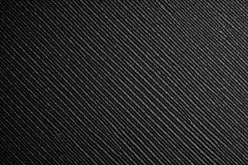 Black and white close up textured surface vertical diagonal lines