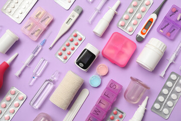 Composition with pulse oximeter, stethoscope and medicines on lilac background