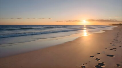 Obraz premium Serene beach at sunset with golden light reflecting on the waves. 