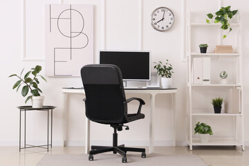 Interior of office with comfortable workplace and modern computer