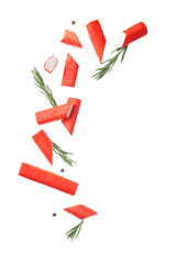 Cut tasty crab sticks with peppercorns and rosemary flying on white background © Pixel-Shot