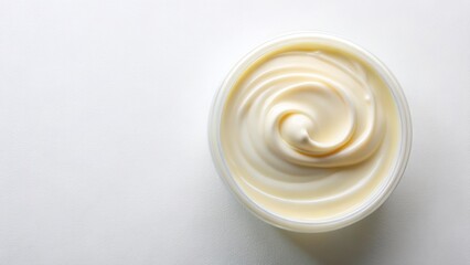 Swirled Cream in a Round Container on a Light Background A Close-Up Image of Smooth, Creamy Texture
