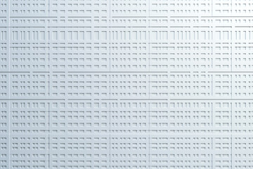 Obraz premium Abstract white textured wall with geometric patterns creating a modern minimalist background.