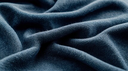 Soft Texture of Dark Blue Fabric Showing Gentle Waves and Creases Close-Up