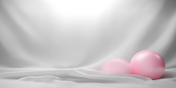 Soft pink balloons on elegant monochrome fabric background with gentle lighting and serene ambiance.