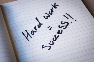 Motivational Quote Handwritten with Marker Pen in Lined Notebook