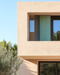 Modern architectural design showcasing a unique window structure against a clear sky