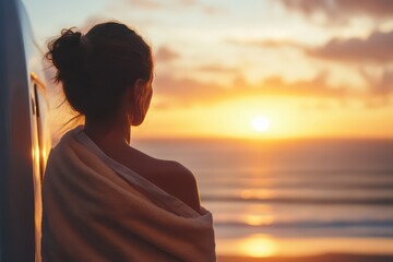 Fototapeta premium A woman wrapped in a towel, standing near her camper van, with salty hair and the sun setting over the ocean after a refreshing swim.
