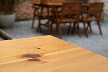Background cafe wood counter blur effect, dark yet cozy ambiance in the restaurant, Table in kitchen, drink wooden desk bokeh light, abstract design for a modern space.