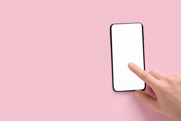Man using mobile phone on pink background. Survey concept