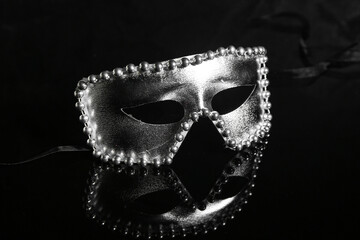 Beautiful silver carnival mask on black background