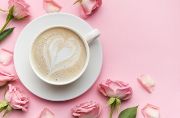 Cappuccino with heart shape latte art and pink roses on pink background