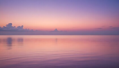 Naklejka premium Simple calm blue sea, ocean under a sunset sky. Gradient sky, gradient sea, colourful, pink sky, purple sky, blue sky, orange sky. Calm mood, mood photo, sea, sky background. Landscape. heaven, dawn. 