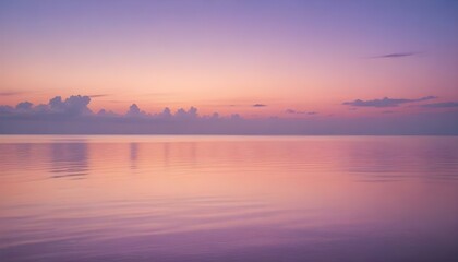 Naklejka premium Simple calm blue sea, ocean under a sunset sky. Gradient sky, gradient sea, colourful, pink sky, purple sky, blue sky, orange sky. Calm mood, mood photo, sea, sky background. Landscape. heaven, dawn. 