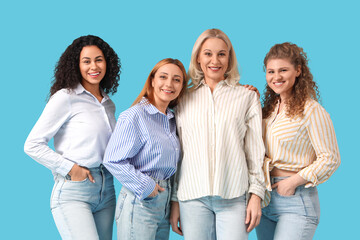 Obraz premium Group of beautiful women smiling on blue background. Women's History Month