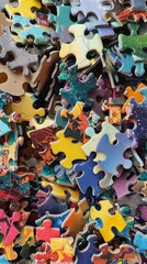 Pile of colorful puzzle pieces.