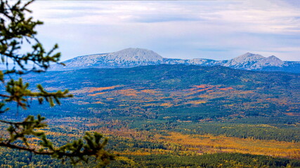 the endless Ural Taiga among the mountains and ridges on a summer day