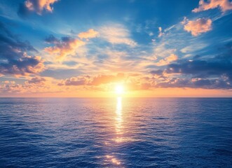 Obraz premium Beautiful sunrise over the sea, blue sky with clouds and sun on the horizon, peaceful nature background. Calm seascape view with copy space for text. Stock photo, empty copy area.