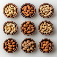 A minimalistic top view of mixed nuts in handcrafted wooden bowls, scattered across a neutral-colored background. 