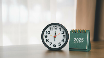 Wooden desktop calendar with clock for 2025, Starting to set goals in 2025