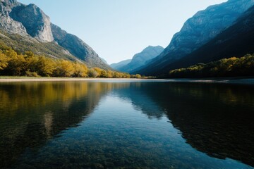 Serene mountain landscape reflecting in tranquil water under cle
