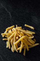french fries on a black background