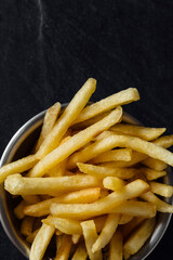 french fries on a black background