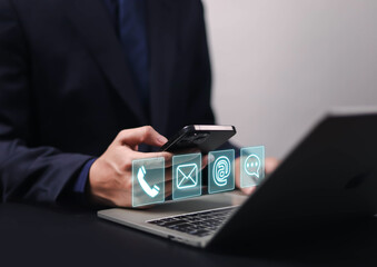 Businessman using phone to contact customer support, showing contact icons (address, phone, email, mobile, call).