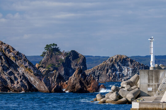 A solitary sentinel stands firm, guarding the coast with unwavering dedication
