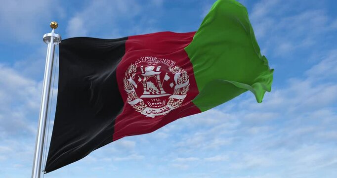 Afghanistan flag with flagpole waving in wind, rolling clouds background looping, 4K video (Perfect Loop)