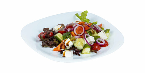 A white plate topped with a fresh salad of mixed vegetables and cheese