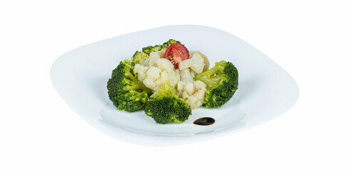 A simple white plate that is beautifully topped with broccoli and cauliflower