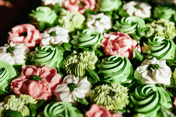Cropped closeup of succulent wedding cupcake display