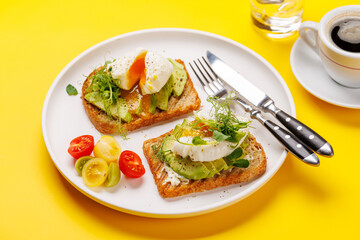Delicious avocado toasts topped with perfectly cooked poached eggs