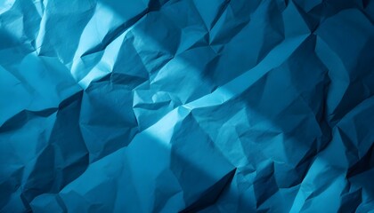 Detailed blue crumpled paper texture serving as a background, featuring a clear area for copy or visual elements